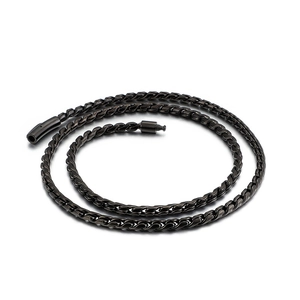 Trend black stainless steel woven chain necklace with cylindrical clasp on white background