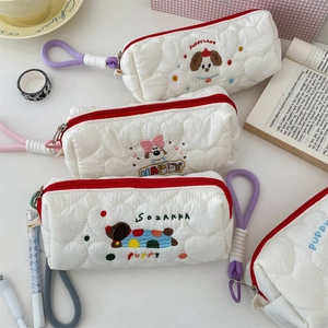 Portable white quilted storage bag featuring cute cartoon puppy embroidery style