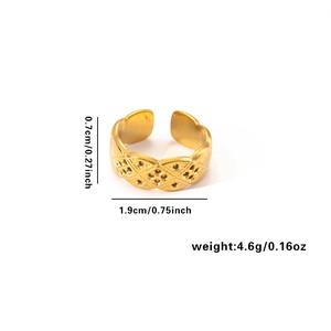 Detailed view of 18k gold plated stainless steel ring with quilted texture and hollow dots