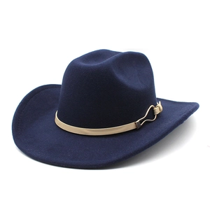 Detailed close-up of navy blue wool felt cowboy hat with khaki band and gold buckle