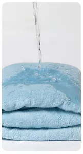 Detail showing strong water absorption of light blue microfiber pet bathrobe fabric