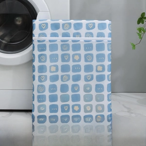 Close-up of small 30x40cm fine mesh laundry bag with blue grid heart patterns