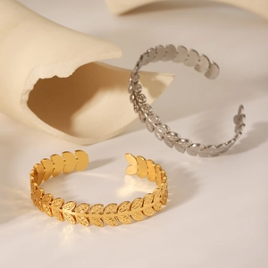 Adjustable stainless steel leaf pattern cuff bracelets in gold and silver finish