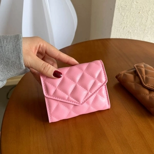 Pink quilted faux leather mini wallet with compact flip cover and card slots for women