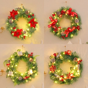 LED lighted Christmas wreath collection with pine cones, red berries and holiday ribbons