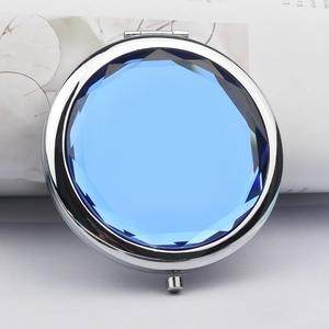 Portable double-sided folding metal makeup mirror with blue faceted crystal top inlay