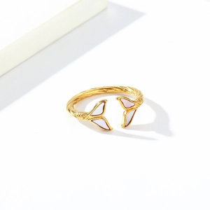 Macro view of fishtail titanium steel ring with shell inlay and twisted band detail