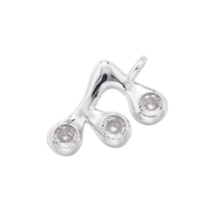 Macro view of silver eighth note pendant with three sparkling transparent gemstones