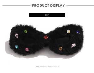 Detail of furry cat-eye sunglasses with colorful rhinestones on black plush frames