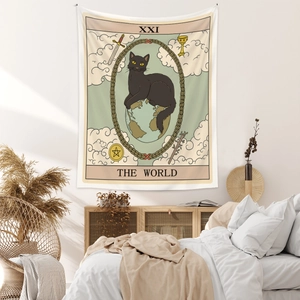 Detailed close-up of The World tarot tapestry featuring a black cat and floral frame