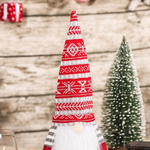 Christmas forest gnome wine bottle cover with red striped knit hat and white plush beard