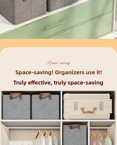 Space-saving foldable gray storage box with leather handles and steel frame detail