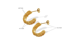 Detailed size view of gold C-shape earrings with irregular hammered lava texture