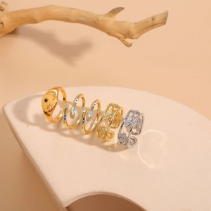 Close-up of celestial moon and evil eye rings with zircon stones on a plaster base