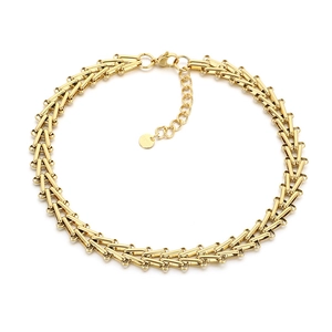Golden stainless steel T-link chain necklace with lobster clasp and extension on white background