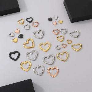 Polished heart pendants in gold, silver, black, and rose gold with crystal accents