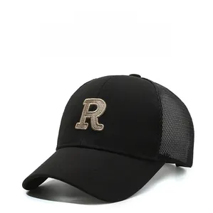 Detail of 3D embroidered R letter on black mesh baseball cap for sun protection