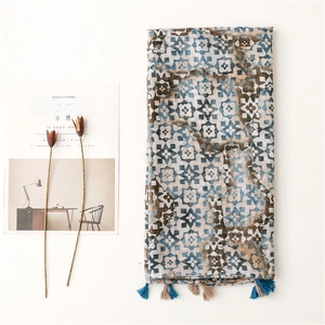 Artistic gradient geometric scarf with fringe tassels on white minimalist background