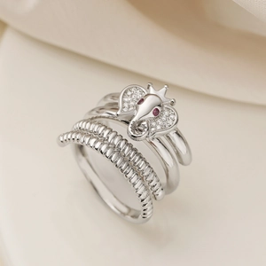 Exquisite silver elephant ring with white zircon pave and ruby accents in a regal crown style