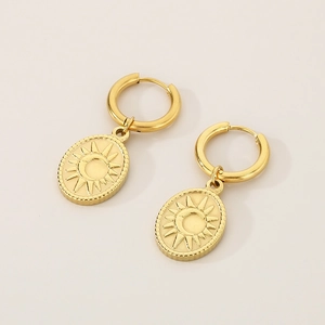 Detailed close-up of 18K gold-plated oval pendant earrings with celestial sun and moon motif