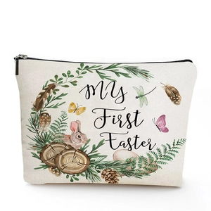Close-up of linen makeup bag with My First Easter bunny watercolor illustration