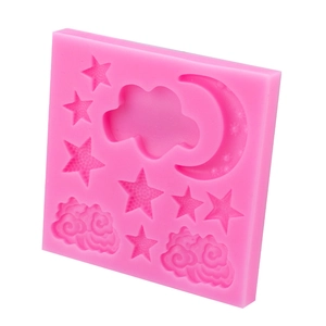 Pink silicone mold featuring various stars, clouds, and moon shapes for DIY fondant cakes
