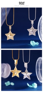 Detail of gold and silver star pendants with micro-inlaid zircons and snake chains