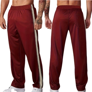 Men's loose straight leg burgundy track pants with cream side stripes and elastic waist
