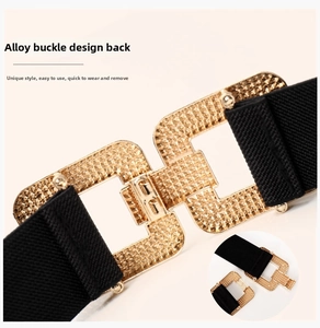 Detail of gold alloy buckle with grainy texture and snap closure on black elastic belt