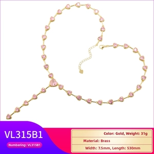 Elegant gold brass heart necklace with pink crystals in a stylish Y-shaped link design