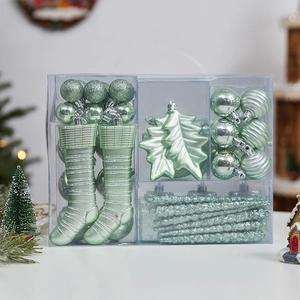 Mint green Christmas ornaments set with balls and stockings in a transparent gift box