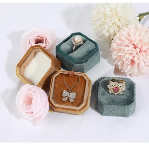 Elegant octagonal velvet jewelry boxes in yellow and green with floral decoration