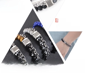 Detail of double-layer stainless steel bracelet with natural tiger eye and black stone