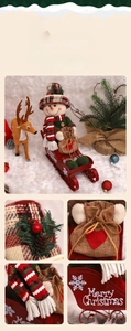 Detail of Christmas snowman doll on a red metal sleigh with a reindeer and Merry Christmas logo