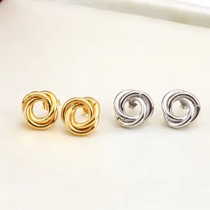 Minimalist twisted knot earrings in gold and silver finish, elegant metallic jewelry