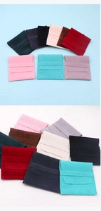 Detailed macro shot of square velvet jewelry pouches in various vibrant macaron colors