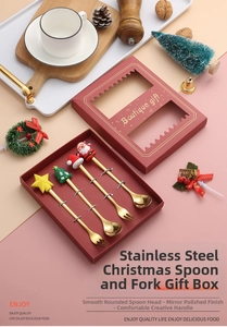 Christmas stainless steel cutlery set with festive figurines in a boutique gift box