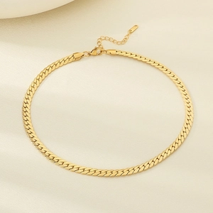 Detail shot of flat 18K gold plated snake chain with lobster clasp and extender