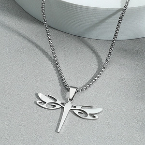 Minimalist silver stainless steel dragonfly pendant necklace on a clean white display stand