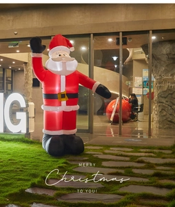 Outdoor inflatable Santa Claus standing on garden lawn for giant Christmas decoration