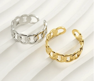 Detailed macro view of gold and silver curb link chain rings with polished mirror finish