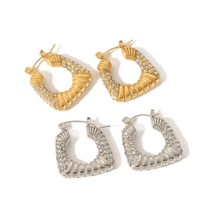 U-shaped hoop earrings in gold and silver finish with sparkling pave zircon accents