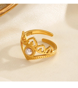 Detail view of crown ring in gold finish with a white pearl and S925 hallmark
