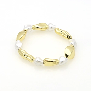 Detail of 18k gold plated bracelet featuring baroque pearls and irregular metal charms