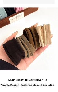 Macro shot of seamless wide elastic hair ties in four earth-toned neutral colors