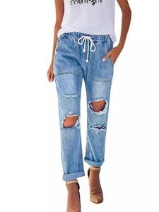 Women's blue ripped jeans with elastic drawstring waist and straight leg fit on model
