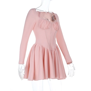 Close-up of pink long sleeve mini dress featuring delicate lace trim and square neckline