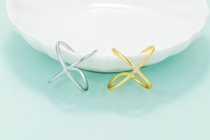 Minimalist X-shaped cross ring with micro-inlaid zircon in gold and silver finishes
