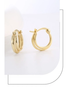Macro shot of 14K gold double-layer hoop earrings showing the S925 hallmark engraving