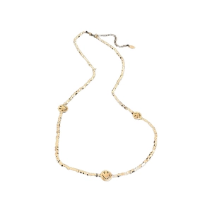 Golden clavicle necklace with three smiley face charms on a textured beaded chain